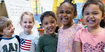 5 Kids Hugging And Smiling