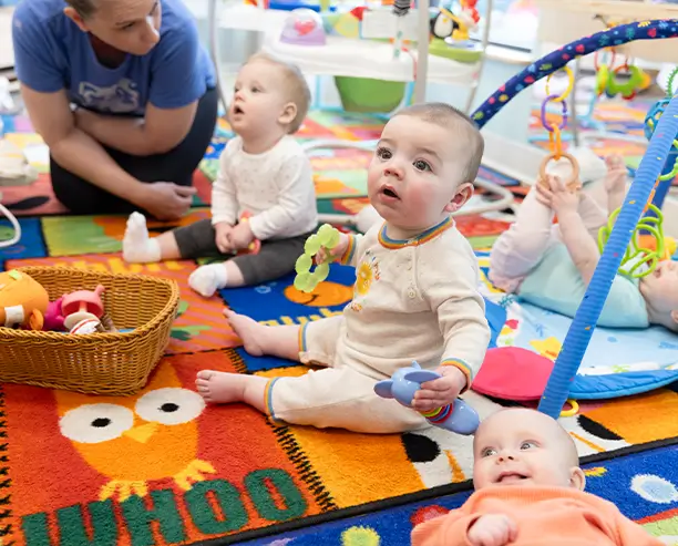 Group Of Babies playing on the floor