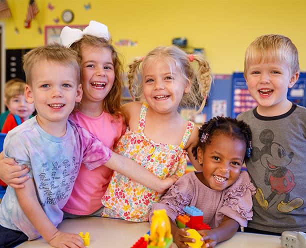 Smiling Group Of Children Preschool Classroom