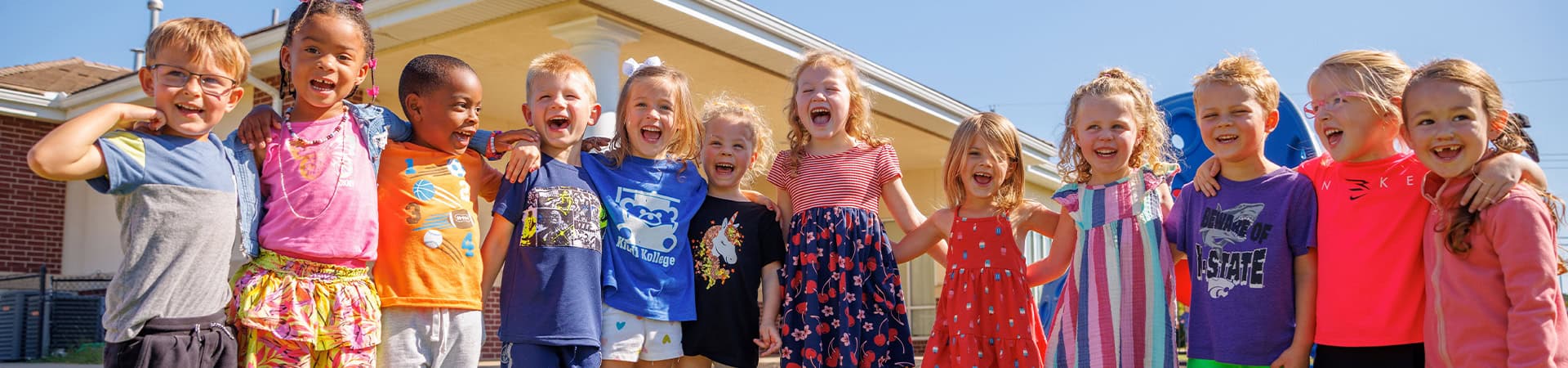Group Of Smiling Children Outdoors Preschool