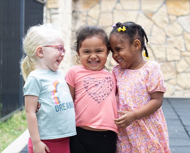 Happy Preschool Girls Playing Outside